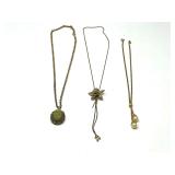 Vintage Vantage perfume locket with carved floral pendant, gold toned lariat necklace with mesh rose flower slider pendant, and faux pearl lariat style necklace