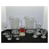 Kitchen ware assortment to include plastic pitchers, glass sundae cups, and more. See pictures for details.
