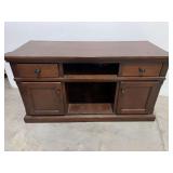 Wooden television stand with cabinet and drawer storage, see pictures for details.