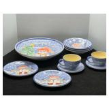 Bella Ceramica dishware, includes bowls, large serving bowl, cups, saucers, and plates. Approximately 10 pieces, see pictures for details.
