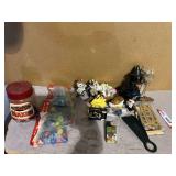 Home decor assortment to include vintage figurines, miniature bobble head, brass key rack, assorted marbles, and more. See pictures for details.