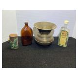 Vintage collectibles to include a brass spittoon, snuff can, liniment bottle, and old liquor bottle