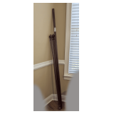 SET OF THREE FLUTED CURTAIN RODS, TWO WITH DECORATIVE FINIALS