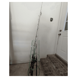 COLLECTION OF FOUR HEAVY FISHING RODS AND REELS WITH PAIR OF TOMATO CAGES