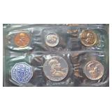 1963 U. S. Uncirculated Mint Set. Includes Silver Franklin Half Dollar, Silver Quarter, Silver Dime. Still in Original Envelope.