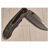 Pocket Knife With Pakkawood Handle and a Thumb Stud.