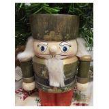 Vintage Wooden Nutcracker Figurine With a Green Uniform,  Red base, and White Faux-Fur air and Beard.