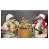 Two Black Santa Claus Figurines With a Gold-Toned, Hexagonal Mesh Decorative Lantern