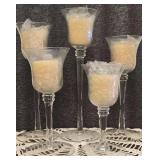 Set of Five Graduated Clear lass Stemmed Candle Holders with Flared Trumpet-Shaped Bowls Containing Candles