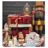 Christmas Lot Includes; Wooden Nut Cracker, Christmas Candle Set, Santas, and More.