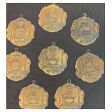 Collection of Vintage Bronze-Toned Masonic Medals/Pendants Featuring an Altar, Working Tools, and the All-Seeing Eye