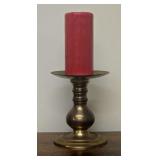 Vintage Solid Brass Candle Holder with a Rounded, Turned Stem and a Wide Drip Pan. Includes a Red Pillar Candle. Overall Height With Candle is 12".
