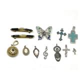 Assorted Costume Jewelry Lot Including Pendants, Brooches, and Charms