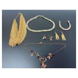 Assorted Fashion Jewelry Lot Including Necklaces, Bracelets, and Earrings in Gold and Copper Tones