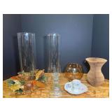 Assorted home decor to include candlestick holders, hurricane candle chimneys, Fish bowl vase, and vintage honeycomb accordion paper vase . See pictures for details.
