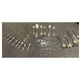 Assorted bottle stoppers, and vintage plated flatware. Tub is not included, see pictures for details.