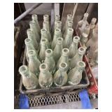 COLLECTION OF 24 VINTAGE COKE BOTTLES - INCLUDING PLASTIC CRATE
