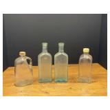 Garage… Vintage collector bottles, four pieces, see pictures for details.
