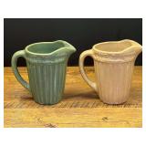 LR…Small vintage stoneware pitchers, set of two, with vertical ribbing and a delicate leaf or floral band motif around its top rim. see pictures for details.