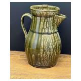 Garage… Shelby West vintage green-glazed pottery pitcher featuring a rustic, dripped reactive or wood ash glaze finish. See pictures for details
