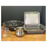 Garage… Kitchen bakeware to include cake pans, Bundt pan, and more. See pictures for details.