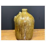 LR…Vintage stoneware jug with an ovoid body and an alkaline glaze with brownish-olive runs. Handle is missing, see pictures for details.