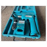 Garage… Makita cordless driver drill, with charger and carrying case, working condition unknown, see pictures for details.