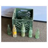 Garage… Crate of assorted vintage glass drink bottles, see pictures for details.