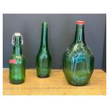 Garage… Vintage collectible green bottles with embossed decoration, three pieces, see pictures for details.