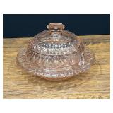 Bath…Vintage pink depression glass round covered butter dish in the "Holiday" (or "Buttons and Bows") pattern, believed to be made by the Jeannette Glass Company during the 1930s or 1940s. See pictu