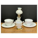 LR…Vintage white milk glass items, including a miniature oil lamp with a diamond pattern, vintage milk glass cup and saucer set in the Harvest Grape pattern, believed to be vintage Indiana glass, an