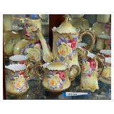 LR… Vintage hand painted Nippon China to include sugar and creamer, cups, saucers, bedside water carafe, coffee/tea pot. Has floral motif and gold painted trim. See pictures for details.