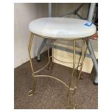 Garage… Round upholstered vanity seat with gold tone metal base, see pictures for details.