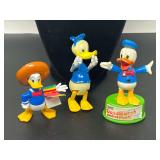 Collection of Donald Duck Character Figures and Push-Up Puppet