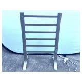Garage…Freestanding electric heated towel warmer rack, powers up, see pictures for details.