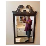 Bath…Vintage Chippendale-style wall mirror, with a distinctive scrolled pediment crest typically crafted from mahogany or cherry wood. See pictures for details.