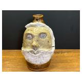 LR… Marie Rogers ugly face jug, some of the trim around the face is missing, and cracked, however, jug is intact. See pictures for details.