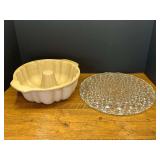 Garage…Stoneware fluted bundt pan, believed to be Pampered Chef, also includes a vintage cake plate with the classic daisy and button pattern. See pictures for details.
