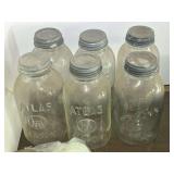 Garage… Vintage/antique large canning jars with lids and porcelain caps, see pictures for details.