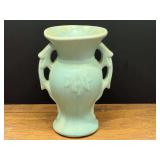 LR…Vintage 1940s McCoy Pottery two-handled vase featuring a distinctive matte seafoam green finish and an embossed leaf design. See pictures for details.