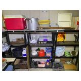 Garage… Large lot of assorted household items to include bed rails, large stock pot, planters, Rubbermaid cooler, portable shelving, food carrier, wicker shelf, and much more. See pictures for detai