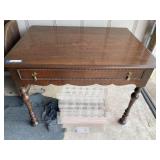 Garage…Vintage/antique wood writing desk / library table with a lovely, scalloped apron, turned legs, and decorative brass bail pull handles. See pictures for details.