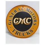 GMC trucks round metal sign