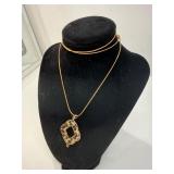 Gold tone necklace with leopard pendant