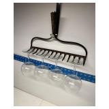 Repurposed rake head wine rack with wine glasses
