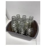 Several dozen tea candle glass cups
