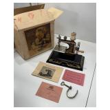 Vintage casige German toy sewing machine and box
