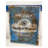 Smith and Wesson metal sign rusted
