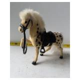 Toy horse with saddle
