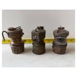 vintage brass miners' carbide lamps.